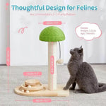 A gray cat sits beside a wooden cat tree with a green mushroom-shaped scratching top and a laser-like dangling toy, shown with overlaid dimensions and text highlighting thoughtful design for felines.