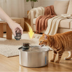 Cat drinking from the fountain with the replaceable filter cartridge shown