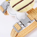 Dog collar with a plush toy attached on a white background