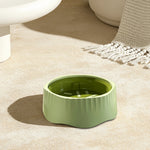 Green slow feeder bowl with dimensions and mode labels