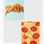 Hands squeezing the pizza plush dog toy to show the squeaker