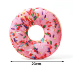 Pink donut with colorful sprinkles and measurement label on a white background