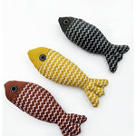 Three fish-shaped cat toys with zigzag pattern on a white background