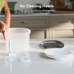 Kitchen setup with a person holding a container, emphasizing ease of disassembly.