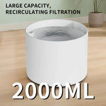 White pet water fountain with text highlighting large capacity and recirculating filtration on a wooden surface.
