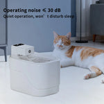 Cat lying next to a white pet fountain with text indicating quiet operation.